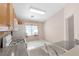 Kitchen with oak cabinets, white appliances, and tile flooring at 1226 Sunfire St, Henderson, NV 89014