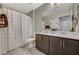 Bathroom featuring a double sink vanity, shower, and neutral color palette at 12898 Slipknot St, Las Vegas, NV 89141