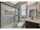 Modern bathroom featuring a glass shower with a rain shower head and a sleek vanity at 12898 Slipknot St, Las Vegas, NV 89141