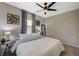 Bedroom with ceiling fan, decor, and natural light from the window at 12898 Slipknot St, Las Vegas, NV 89141