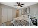 Bright bedroom featuring a ceiling fan, closet, and stylish decor at 12898 Slipknot St, Las Vegas, NV 89141