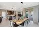 Bright dining area flows into the kitchen and Gathering room, with sliding doors for indoor/outdoor living at 12898 Slipknot St, Las Vegas, NV 89141