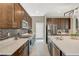 Stylish kitchen with stone countertops, mosaic backsplash, and stainless-steel appliances at 12898 Slipknot St, Las Vegas, NV 89141