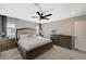 Spacious bedroom featuring a ceiling fan, neutral colors, and dual nightstands at 12898 Slipknot St, Las Vegas, NV 89141