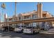 Covered parking in front of building with palm trees at 1375 E Hacienda Ave # 201, Las Vegas, NV 89119