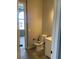 Clean bathroom with toilet, sink, and tiled floor at 1400 Equestrian Ct, Pahrump, NV 89048