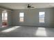 Main bedroom with carpet flooring and large windows at 1400 Equestrian Ct, Pahrump, NV 89048