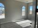 Spacious bedroom with carpet and large arched windows at 1400 Equestrian Ct, Pahrump, NV 89048