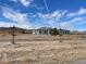 House with a large front yard and desert landscape at 1400 Equestrian Ct, Pahrump, NV 89048