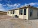 Exterior view of the house showcasing stucco and landscaping at 1400 Equestrian Ct, Pahrump, NV 89048