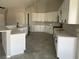 Spacious kitchen with white cabinets and quartz countertops at 1400 Equestrian Ct, Pahrump, NV 89048