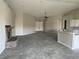 Open floor plan with a stone fireplace at 1400 Equestrian Ct, Pahrump, NV 89048