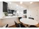 Bright dining area with a round table and four black chairs, near kitchen at 150 Las Vegas Blvd # 1909, Las Vegas, NV 89101