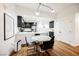 Modern dining area with marble table and black chairs near kitchen at 150 Las Vegas Blvd # 1909, Las Vegas, NV 89101