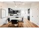 Modern dining area with marble table and black chairs near kitchen at 150 Las Vegas Blvd # 1909, Las Vegas, NV 89101