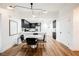 Modern dining area with marble table and black chairs near kitchen at 150 Las Vegas Blvd # 1909, Las Vegas, NV 89101