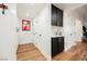 Built-in bar with black cabinets and wood floors at 150 Las Vegas Blvd # 1909, Las Vegas, NV 89101