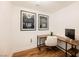 Corner office with wood desk, white chair, and city skyline art at 150 Las Vegas Blvd # 1909, Las Vegas, NV 89101