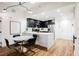 Modern kitchen with dark cabinetry, white countertops, and breakfast bar at 150 Las Vegas Blvd # 1909, Las Vegas, NV 89101