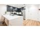 Contemporary kitchen featuring dark cabinetry, stainless steel appliances, and a marble island at 150 Las Vegas Blvd # 1909, Las Vegas, NV 89101