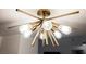 Modern gold light fixture with multiple lights at 150 Las Vegas Blvd # 1909, Las Vegas, NV 89101