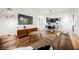 Open living area with brown leather sectional sofa and mid-century modern accents at 150 Las Vegas Blvd # 1909, Las Vegas, NV 89101