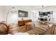 Open living area with brown leather sectional sofa and mid-century modern accents at 150 Las Vegas Blvd # 1909, Las Vegas, NV 89101