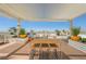 Rooftop deck with pergola, tables, chairs, and city views at 150 Las Vegas Blvd # 1909, Las Vegas, NV 89101