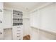 Spacious walk-in closet with custom shelving and drawers at 150 Las Vegas Blvd # 1909, Las Vegas, NV 89101