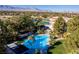 Resort-style pool with shade structures at 1613 Iron Ridge Dr, Las Vegas, NV 89117