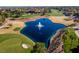 Lake on a lush golf course with fountain at 1613 Iron Ridge Dr, Las Vegas, NV 89117