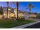 Beautiful two-story home at dusk with palm trees at 1613 Iron Ridge Dr, Las Vegas, NV 89117