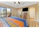 Main bedroom with king bed, private access to the bathroom, and a TV at 1851 Hillpointe Rd # 2123, Henderson, NV 89074