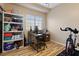 Home office space with desk, chair, and storage shelving at 1851 Hillpointe Rd # 2123, Henderson, NV 89074