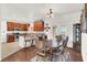 Bright dining area with wood table and chairs, adjacent to kitchen at 1920 Cavalry St, Pahrump, NV 89048