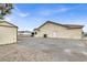 House exterior with gravel driveway and shed at 1920 Cavalry St, Pahrump, NV 89048