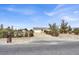 Single-story home with a long driveway and landscaped front yard at 1920 Cavalry St, Pahrump, NV 89048