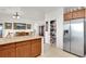 Kitchen boasts ample cabinet space, granite countertops, and a large pantry at 1920 Cavalry St, Pahrump, NV 89048