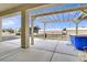 Relaxing covered patio with pergola, chairs, and a pool at 1920 Cavalry St, Pahrump, NV 89048