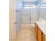 Bathroom with tub, shower, and wood cabinets at 2000 Golden Shadow Ct, Henderson, NV 89002