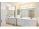 Double vanity bathroom with mirrored sliding doors and tile flooring at 2000 Golden Shadow Ct, Henderson, NV 89002