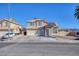 Two-story house with solar panels and a two-car garage at 2000 Golden Shadow Ct, Henderson, NV 89002