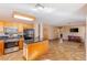 Kitchen with island, stainless steel appliances, and view into living area at 2000 Golden Shadow Ct, Henderson, NV 89002