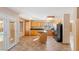 Kitchen with island, wood cabinets, and black appliances at 2000 Golden Shadow Ct, Henderson, NV 89002