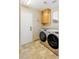 Laundry room with washer, dryer, and cabinets at 2000 Golden Shadow Ct, Henderson, NV 89002