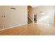 Light-filled living room with hardwood floors and stairs at 2000 Golden Shadow Ct, Henderson, NV 89002