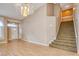 Living room with hardwood floors, stairs and chandelier at 2000 Golden Shadow Ct, Henderson, NV 89002