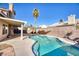 Inviting kidney-shaped pool with patio cover and seating at 2000 Golden Shadow Ct, Henderson, NV 89002