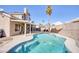 Inviting kidney-shaped pool with patio cover and seating at 2000 Golden Shadow Ct, Henderson, NV 89002