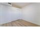 Simple bedroom with light wood flooring and a large closet at 214 W Atlantic Ave, Henderson, NV 89015